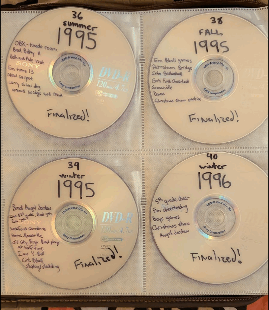 4 DVDs in a CD binder, all labeled in Sharpie 1995 and 1996
