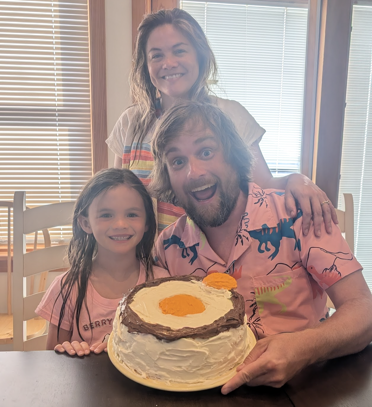 Brad and his family with an atomic design birthday cake