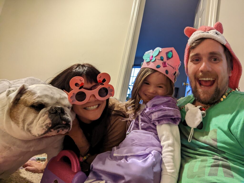 Brad, Ella, Melissa, and Ziggy dressed up in costumes and smiling