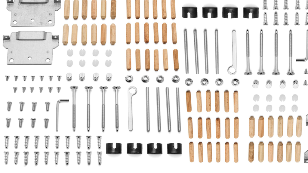 A picture of small Ikea components: dow rods, brackets, and screws