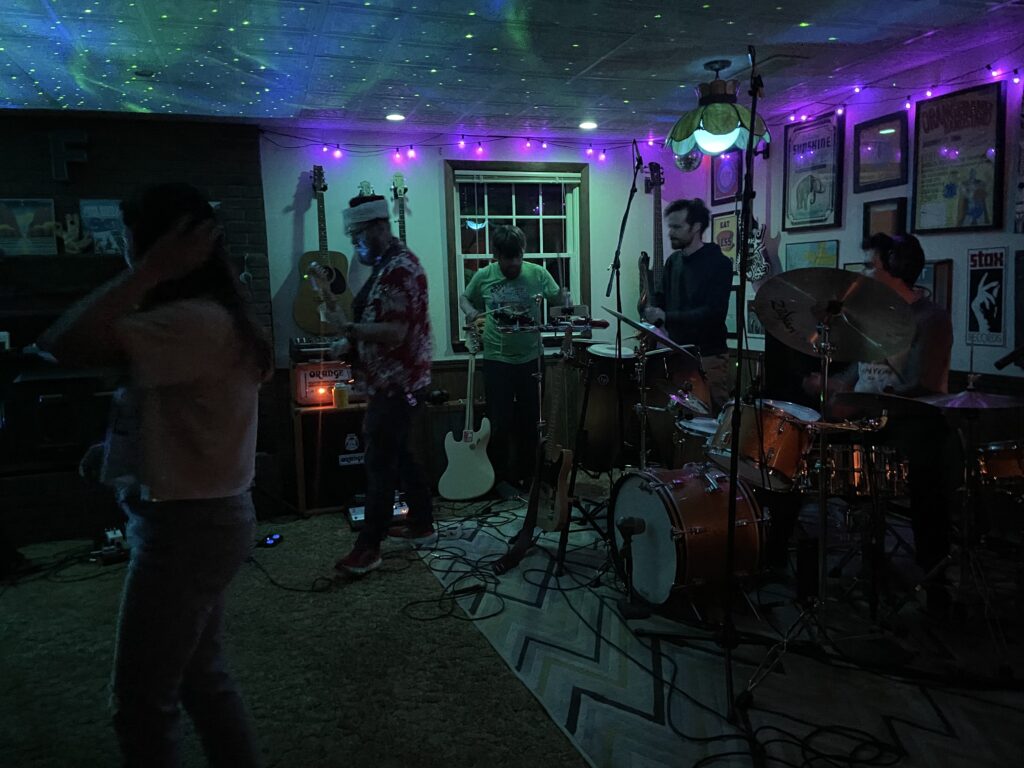 Musicians in Brad's lit-up basement