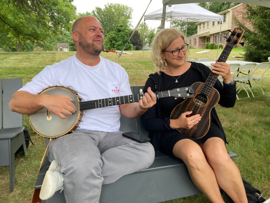 Chris Coyier and Jessica Spengler playing music outside at the Frostapalooza pre party