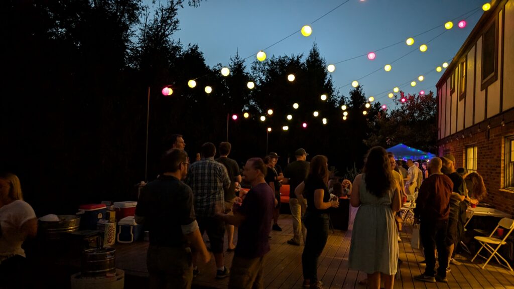 Frostapalooza pre-party on Brad's deck with colorful string lights