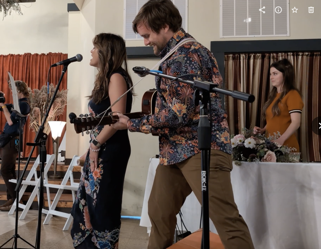 Brad and Melissa performing at a wedding